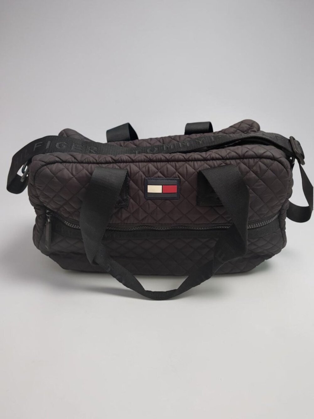 Tommy Hilfiger Quilted Black Duffel Bag With Embossed Strap & Zipper Closure